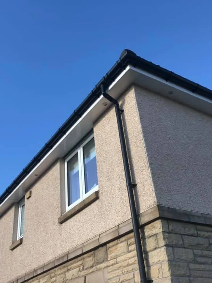 A new-build house in Bishopton, looking up at the eaves from the driveway
